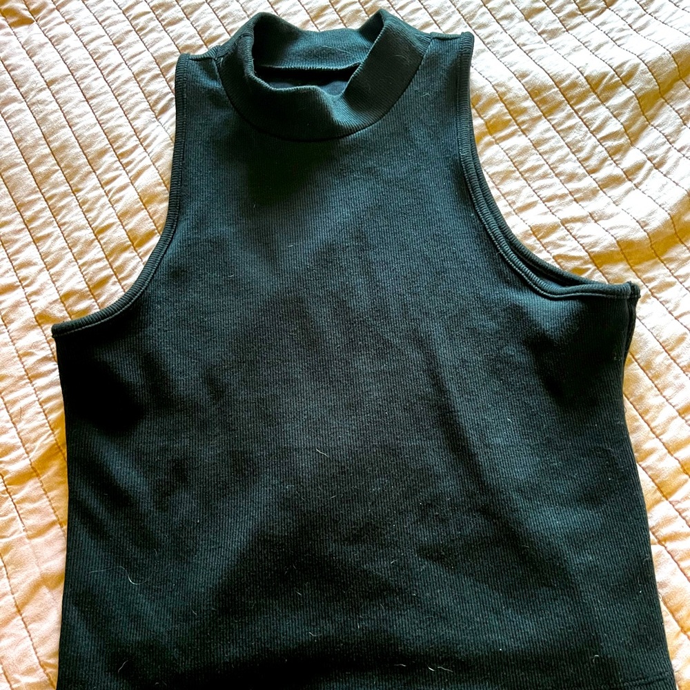 Black sleeveless high-neck top